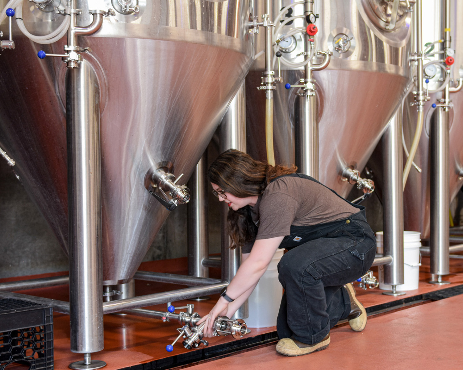 shannon, a brewer, adjusting a tank